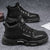 Black suede Winter Vanguard boots with rubber outsole for urban explorers.