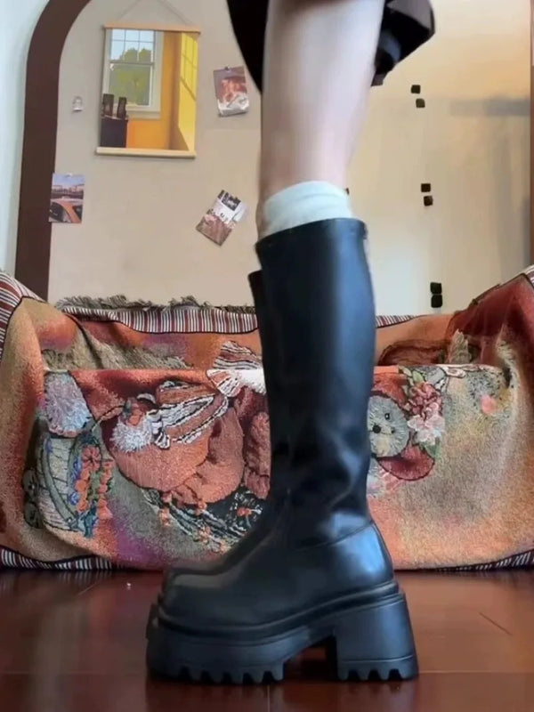 Chic black platform knee-high fashion boots with wedge heel, waterproof design, and bling accents for stylish women.
