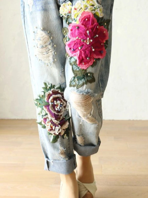 Vintage floral embroidered high-waist denim jeans with a loose fit, perfect for casual wear and stylish outfits.