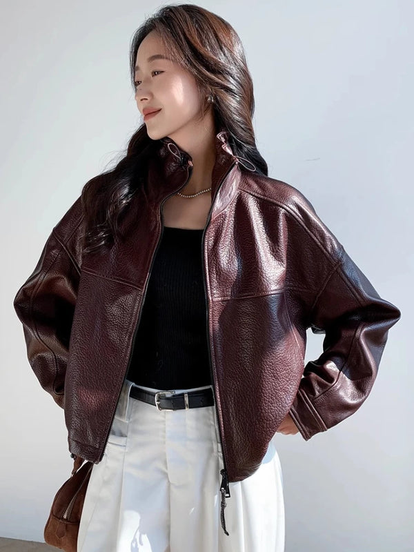 Close-up of the stand collar on the chic vintage leather cropped jacket for women.