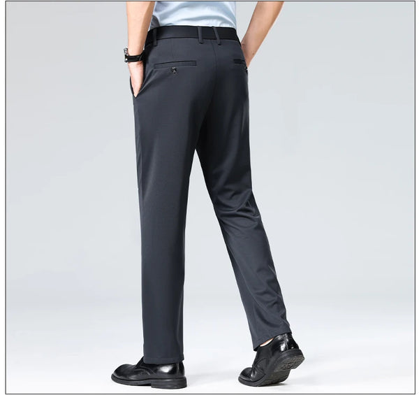 Black stretch pants with sophisticated drape paired with leather dress shoes