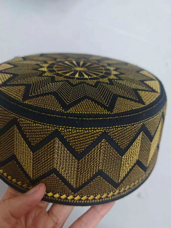 Traditional flat-top prayer cap with detailed gold threadwork and comfortable fit