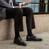 Desai Classic Leather Oxfords on a wooden surface, perfect for formal wear.