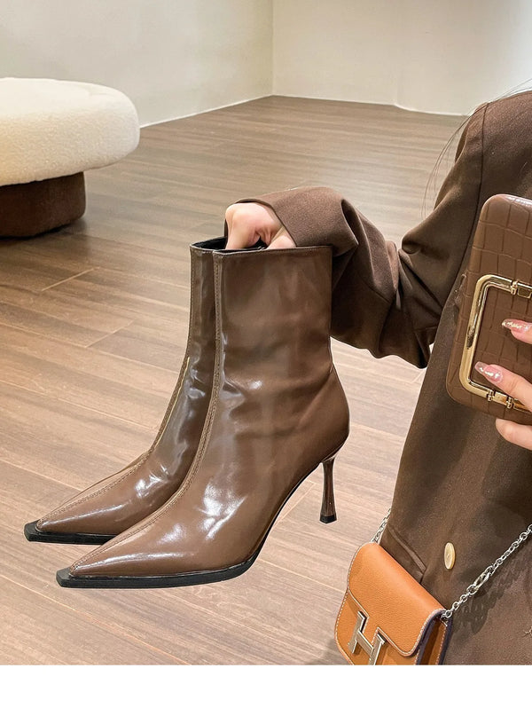Chic women's ankle boots with zipper, high heel, pointed toe, and PU leather for stylish autumn and winter fashion.