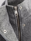 Women's polyester jacket showing belted waist detail and turtleneck collar