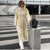 Sophisticated cream trench coat displaying quality polyester fabric construction