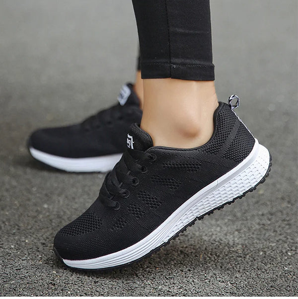 White lace-up sneakers with multi-color accents and cushioned comfort