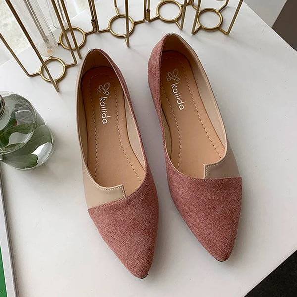 Woman wearing comfortable pointed toe flats during morning commute