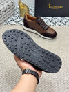 Men's black leather loafers with a classic slip-on style.