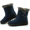 Chic women's waterproof winter boots with plush lining, low heel, and secure hook-and-loop closure for cold weather comfort.
