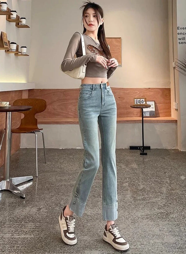 Chic high waist straight leg jeans for women in distressed wash, perfect for casual outings and office wear.
