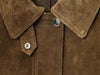 Chic women's leather jacket with button closure, lapel collar, and short length for stylish urban fashion and versatility.