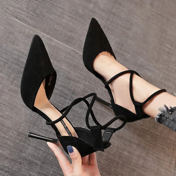 Chic black suede stiletto heels with pointed toe design for women.