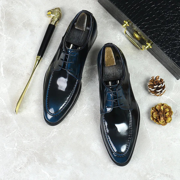 Side view of stylish leather Oxfords featuring a precise lace-up closure.