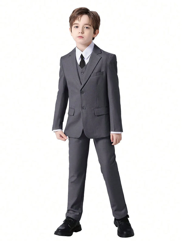 Flat lay of the boys' colorful formal suit set with all pieces arranged neatly.