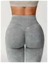 Black ribbed yoga leggings with high-rise waistband for support.