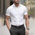 Flat lay of short sleeve business shirt displaying solid pattern and professional design