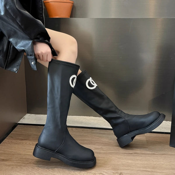 Chic women's knee-high boots with thick sole, stylish PU upper, and rounded toe for winter elegance and comfort.