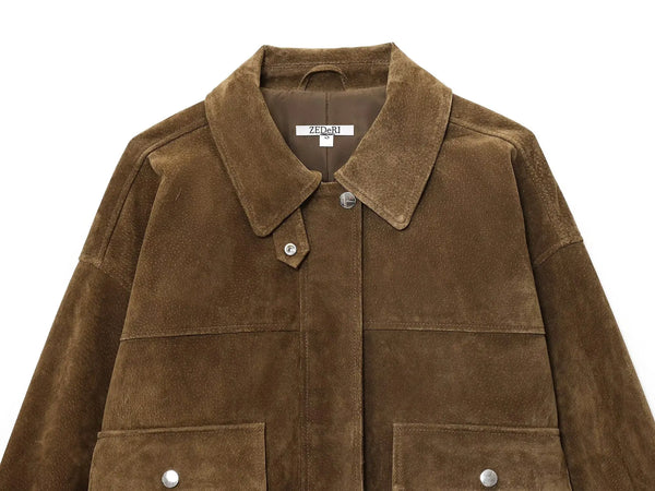 Chic women's leather jacket with button closure, lapel collar, and short length for stylish urban fashion and versatility.