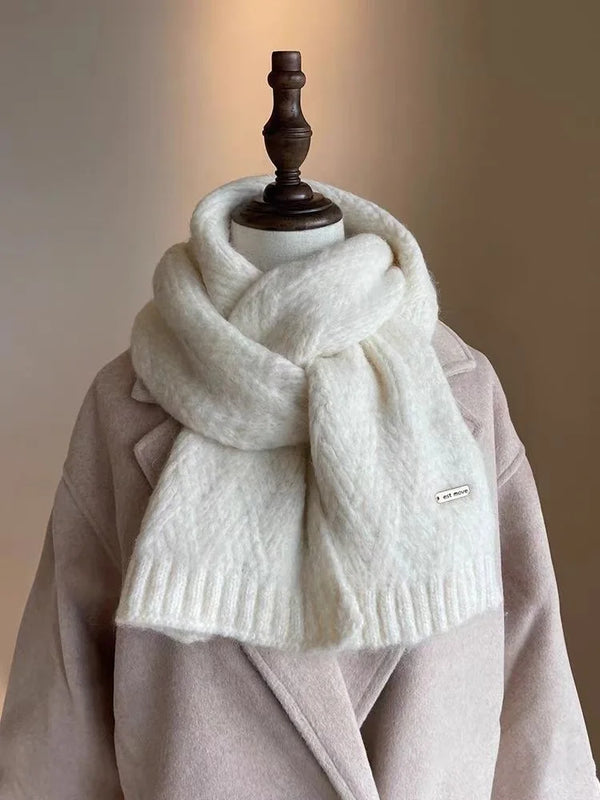 Close-up of the knitted texture of the mink fur scarf, highlighting its luxurious feel.