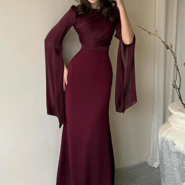 Midnight Elegance Batwing Dress styled for a premiere event, exuding confidence.