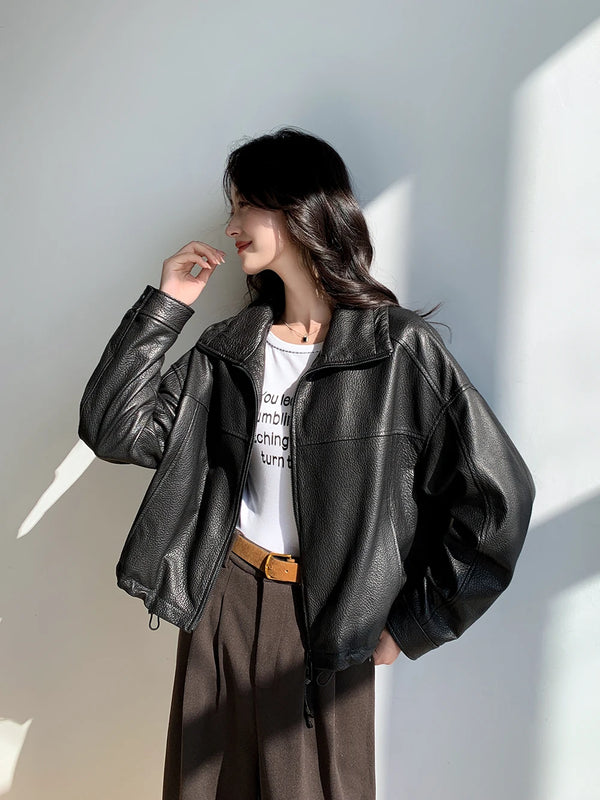 Detail of the stand mandarin collar on the vintage leather cropped jacket.