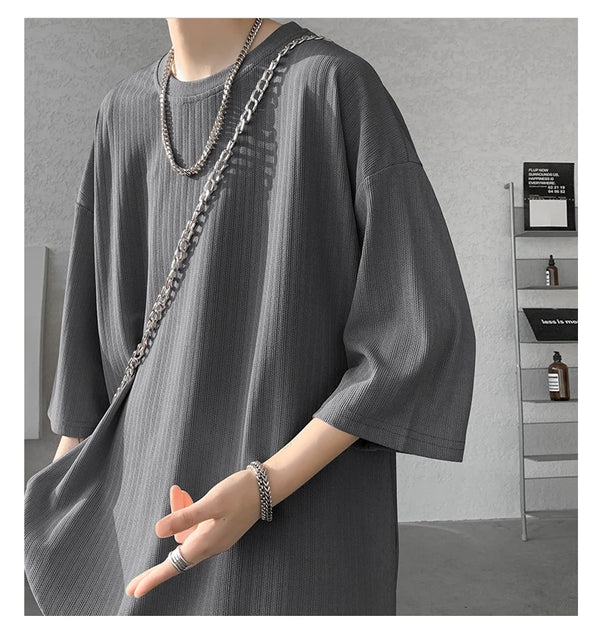 Back view of striped summer tee, emphasizing loose fit and comfort.