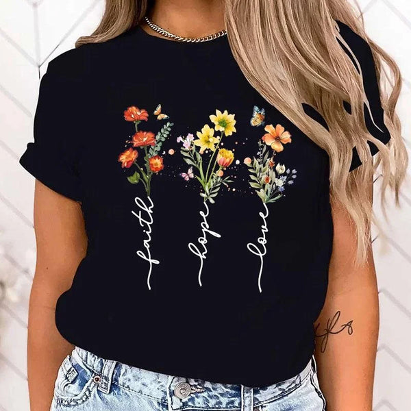 Floral print women's tee featuring 'Faith Hope Love' message, perfect for casual wear and versatile styling in various colors