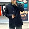 Close-up of the single-breasted front of the Italian men's jacket, showcasing high-quality fabric.
