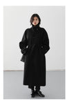 Elegant belted woolen coat in timeless silhouette with modern details