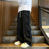 Men's wide-leg jeans in dark wash, perfect for streetwear style.