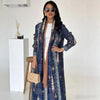 Woman wearing captivating blue hooded long coat with streamlined button-front design