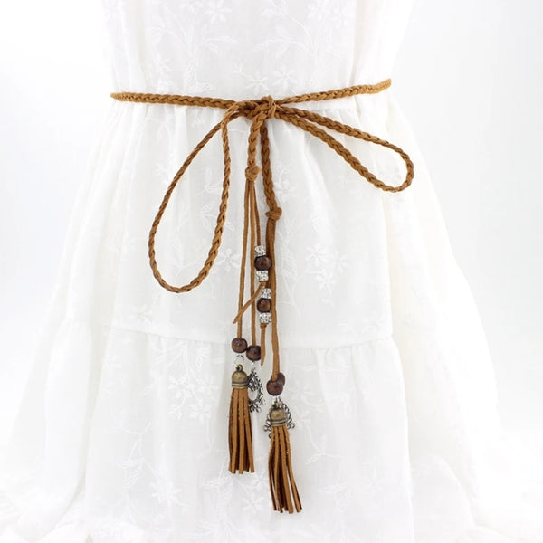 Bohemian braided faux leather skinny belt for women in camel, perfect for casual and formal outfits with fringe accents.