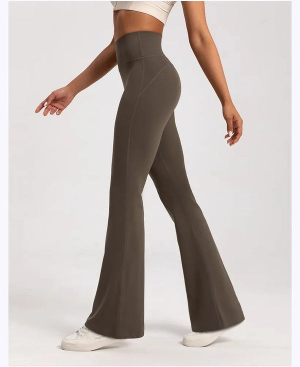 Side view of flexible high-waist wide-leg yoga pants showcasing their flowy design.