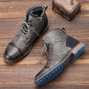 Men's brown leather ankle boots with side zip closure and Western-inspired design