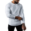 Men's long sleeve cotton tee in black, featuring moisture-wicking technology for comfort and breathability in casual wear.