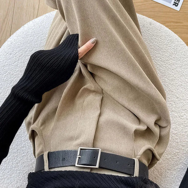 Side view of high waisted corduroy pants showing flattering wide leg cut and elongating effect
