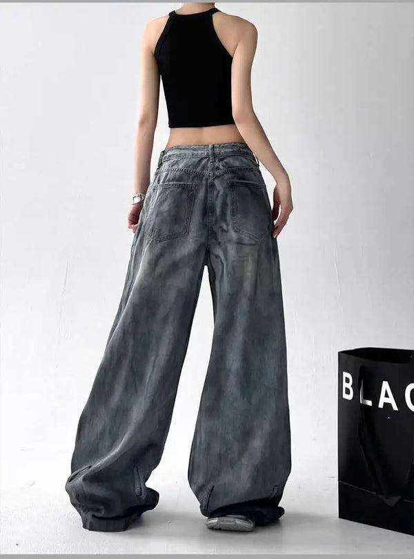 Trendy high-waist wide-leg ripped jeans for women with tie-dye and distressed detailing, perfect for casual street style.