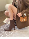 Chic black ankle boots with slim high heels, pointed toe design, perfect for autumn and winter fashion. Stylish slip-on footw