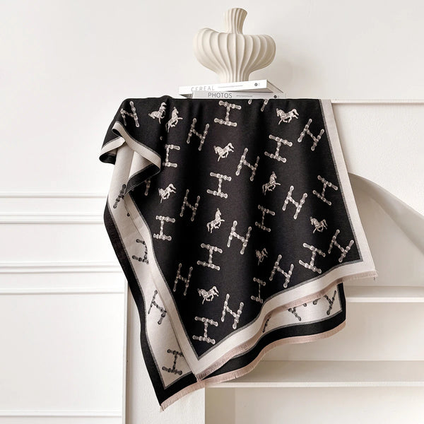 Elegant cashmere wrap with unique floral print, perfect for cold weather.