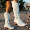 Embroidered mid-calf women's fashion boots with low wedge heel, slip-on design, and durable rubber outsole for comfort and st