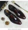Detailed view of the pointed toe on elegant leather Oxfords.