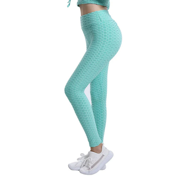 Model wearing high waist push-up leggings in dark grey, highlighting the seamless construction.