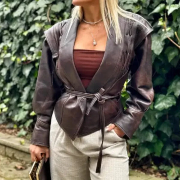 Chic belted leather bomber jacket for women, featuring lace-up detail, hood, and notched lapel, perfect for autumn and winter