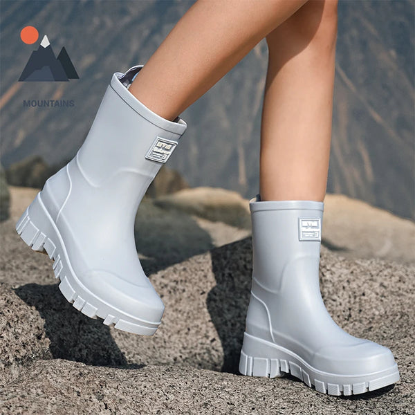 Chic waterproof women's ankle rain boots with non-slip outsole, perfect for rainy days and outdoor events.