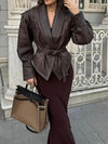 Chic belted leather bomber jacket for women, featuring lace-up detail, hood, and notched lapel, perfect for autumn and winter
