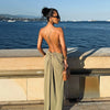 Polyester halter dress with sophisticated backless design and modern waist details