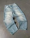 Blue wide-leg jeans featuring relaxed fit and artistic designs.