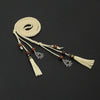 Bohemian braided faux leather skinny belt for women in camel, perfect for casual and formal outfits with fringe accents.