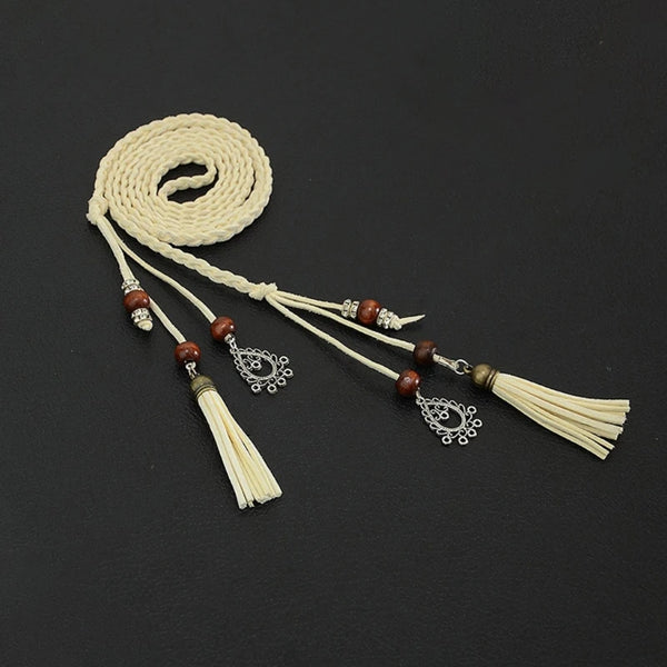 Bohemian braided faux leather skinny belt for women in camel, perfect for casual and formal outfits with fringe accents.